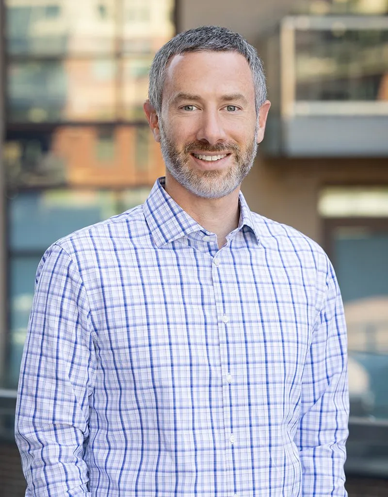 A professional headshot of Rick Pollack.