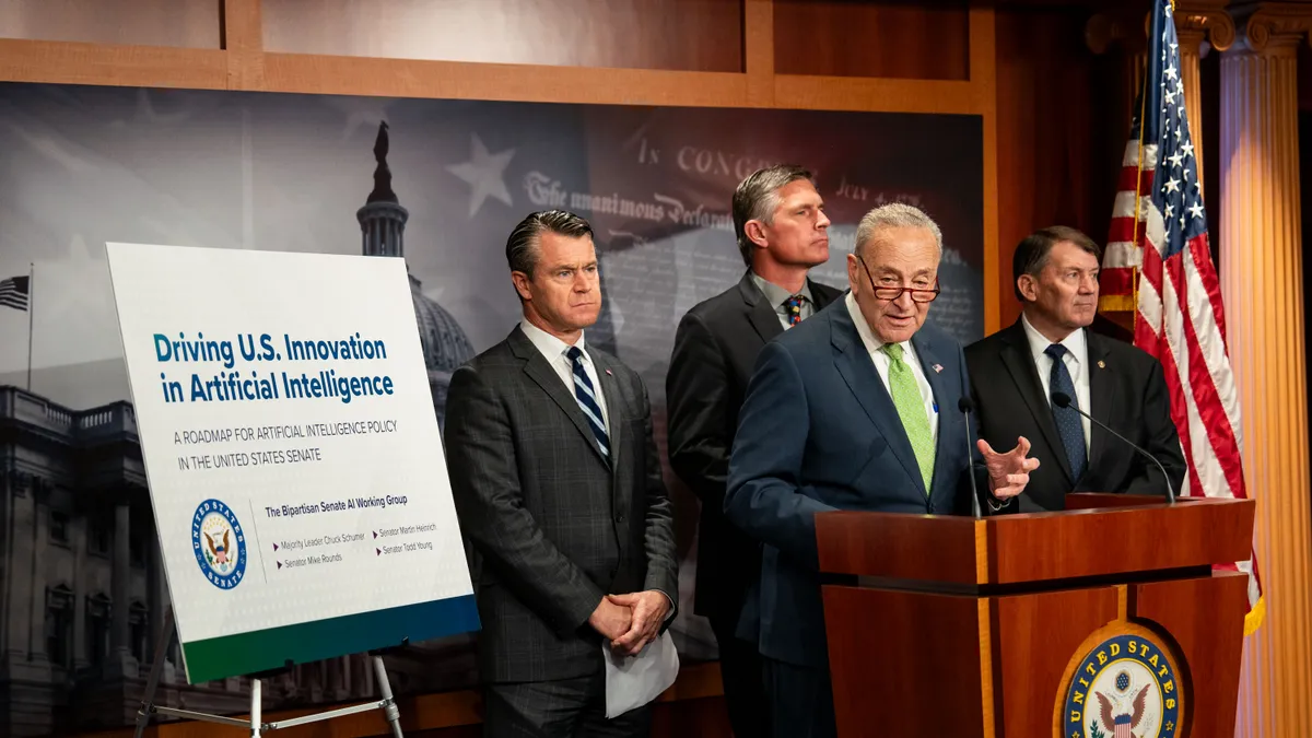 Senate Majority Leader Chuck Schumer (D-NY), flanked by Sen. Todd Young (R-IN), Sen. Martin Heinrich (D-NM) and Sen. Mike Rounds (R-SD), speaks during a news conference at the U.S. Capitol on May 15, 2024 in Washington, DC.