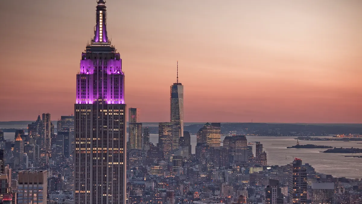 A facade of the 102-story Empire State Building seen at sunrise in New York City.