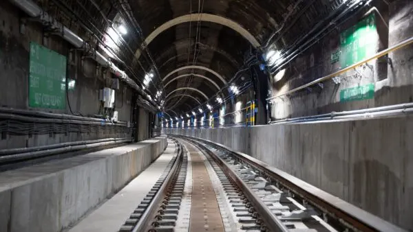 An interior view of an empty rail tunnel.