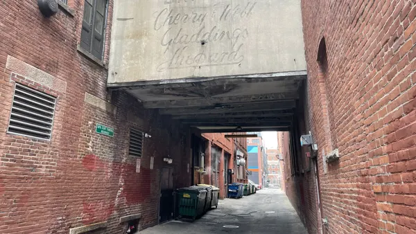View of an alley in Providence, Rhode Island, with dumpsters