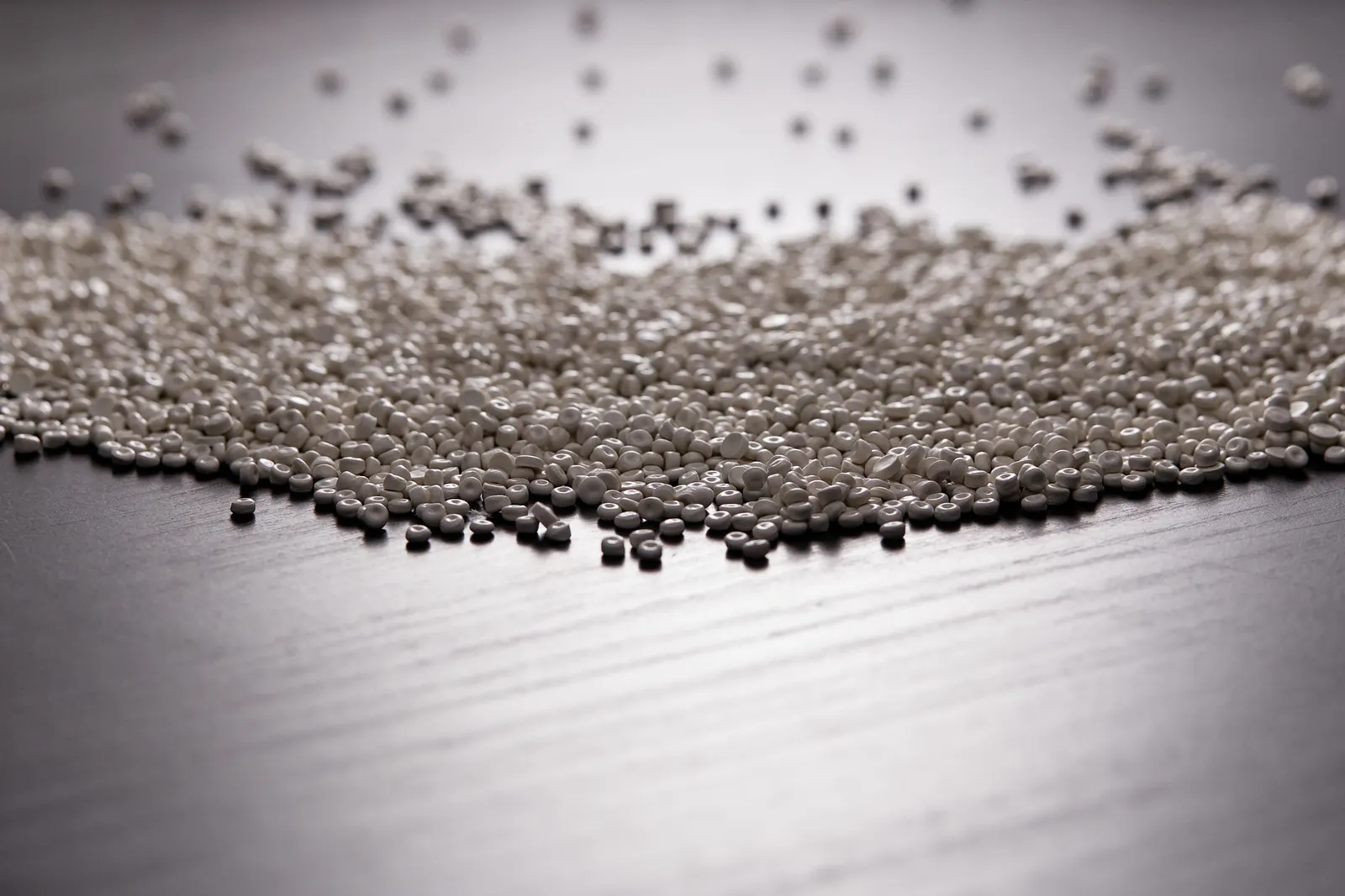 A close-up view of plastic pellets used for manufacturing products.
