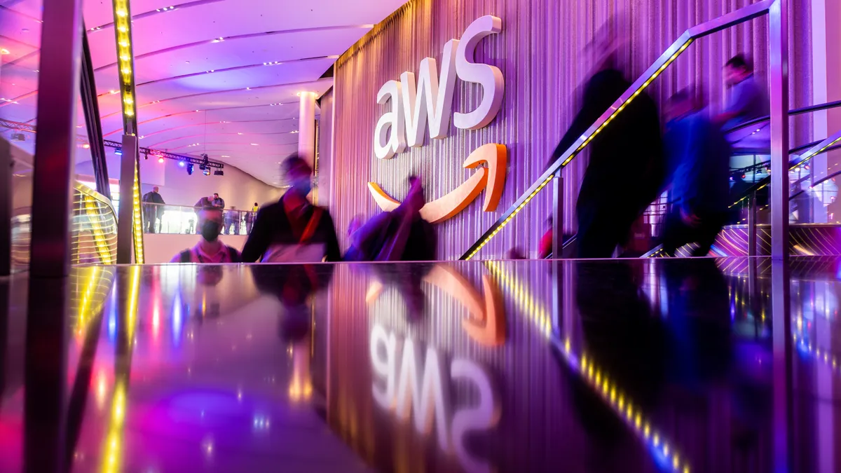 Attendees arrive during AWS re:Invent 2021, a conference hosted by Amazon Web Services, at The Venetian Las Vegas on November 30, 2021 in Las Vegas, Nevada. (