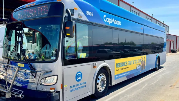 Large blue bus reading "CapMetro" and "automated" on the destination board.