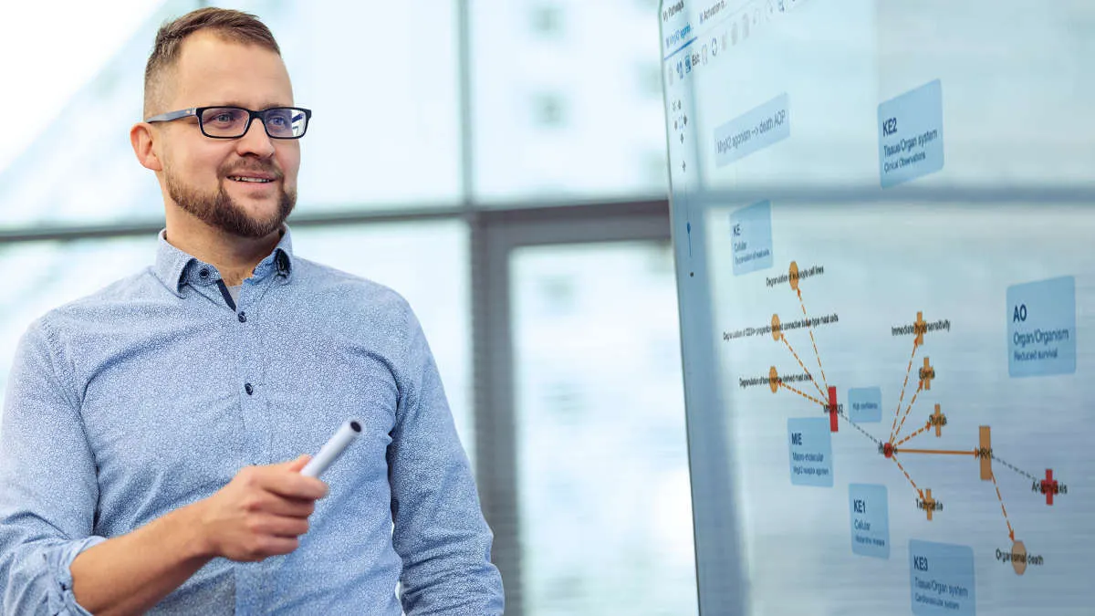 Man pointing at presentation board