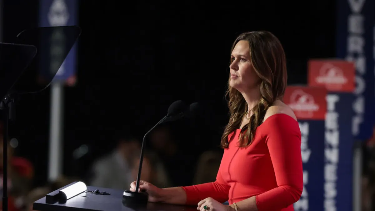 Arkansas Gov. Sarah Huckabee Sanders wears a red dress speaking during the Republican National Convention.