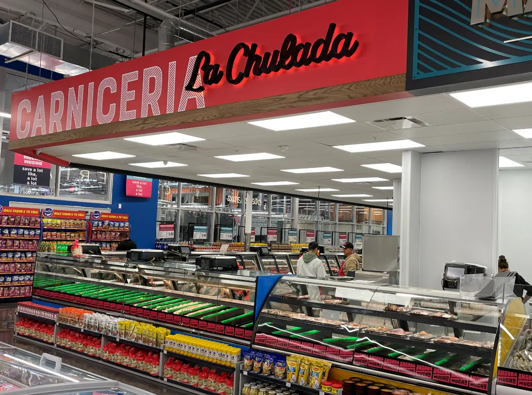 Large meat counter inside Ahorra Mucho grocery store