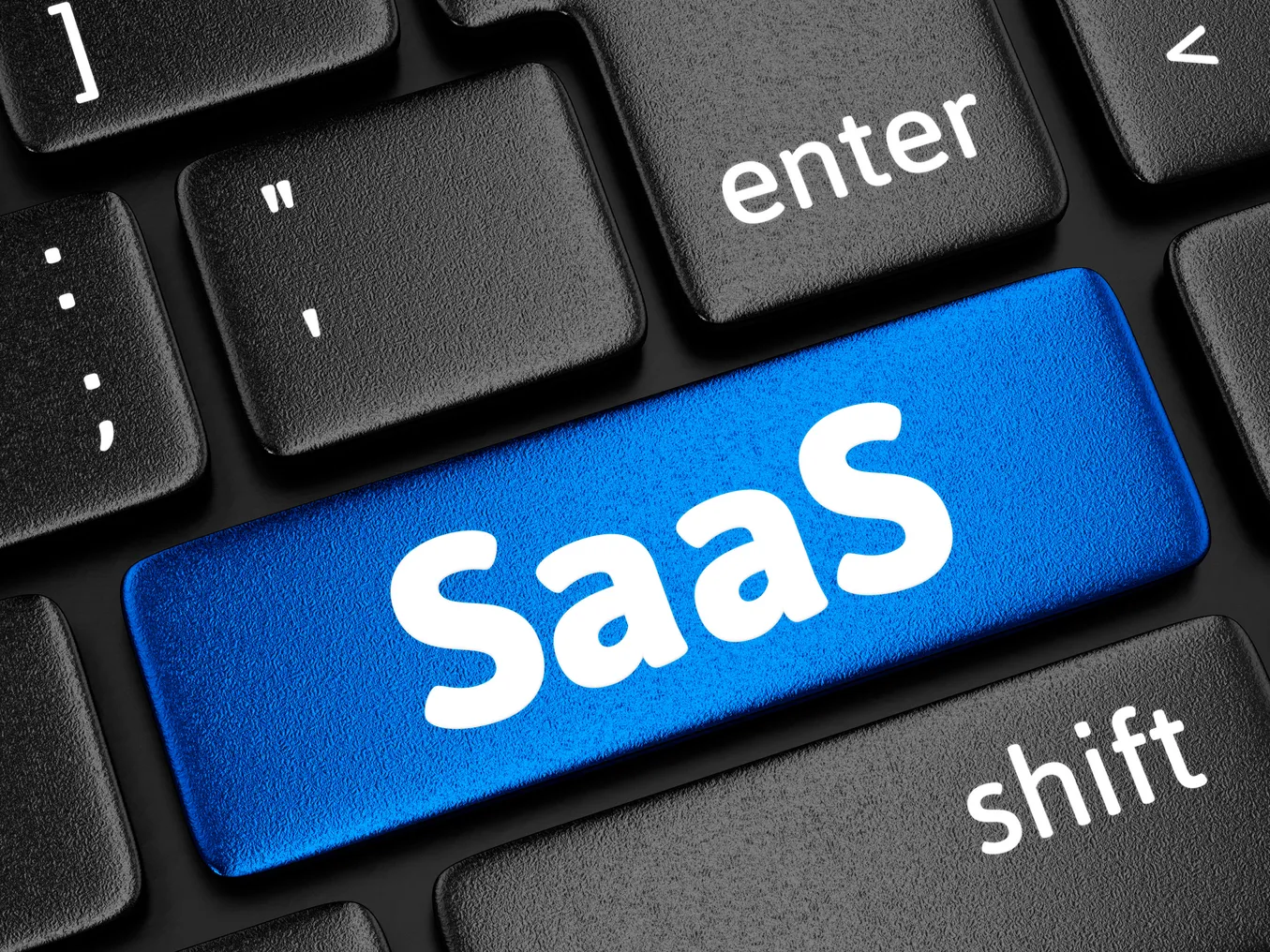 SaaS (Software as a service) key on computer keyboard.