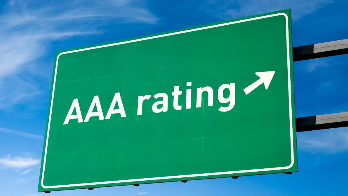 Green sign showing AAA bond rating.