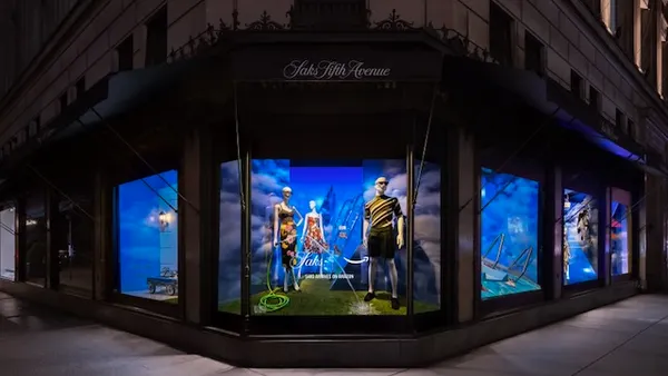 A department store window at night.
