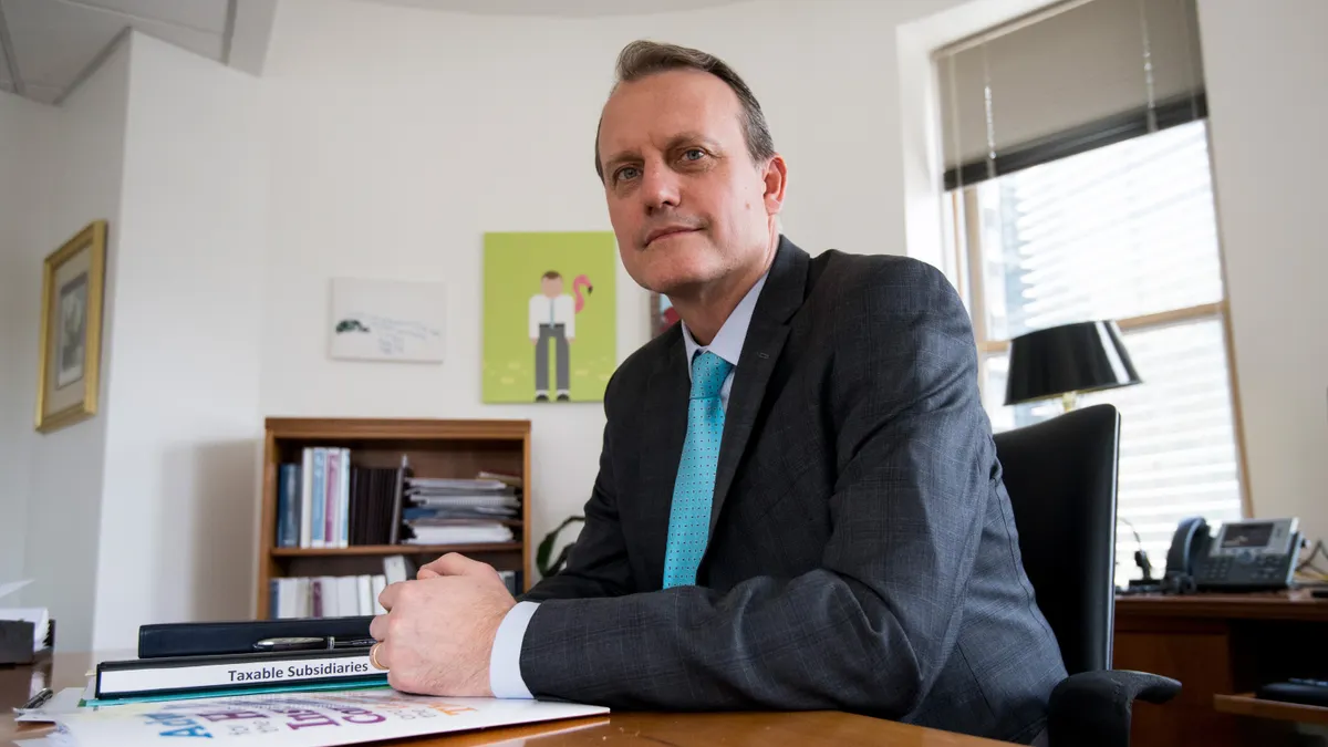a picture of matt eyles at a desk