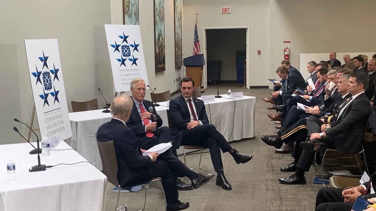 Sen. Angus King, Rep. Mike Gallagher, co-chairs of the Cyberspace Solarium Commission speaking during the report release in Washington on March 12, 2020.