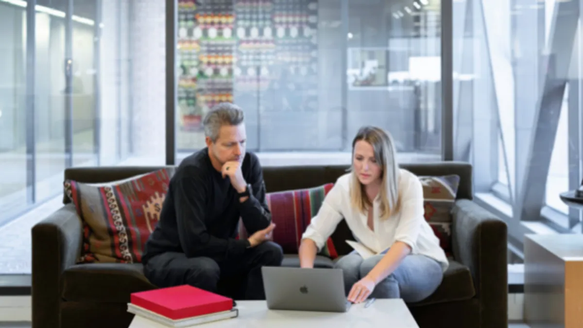 Sales meeting in an open-plan office