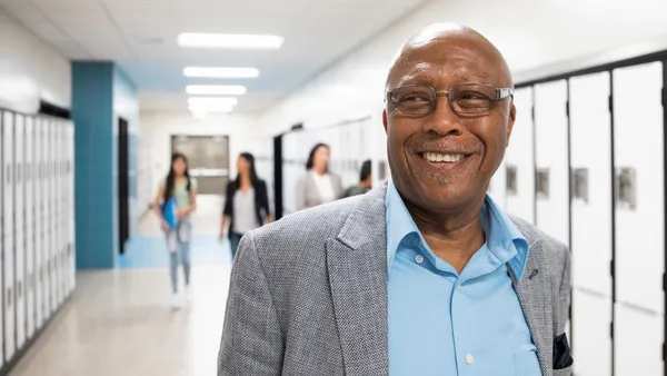 Smiling teacher in the hallway