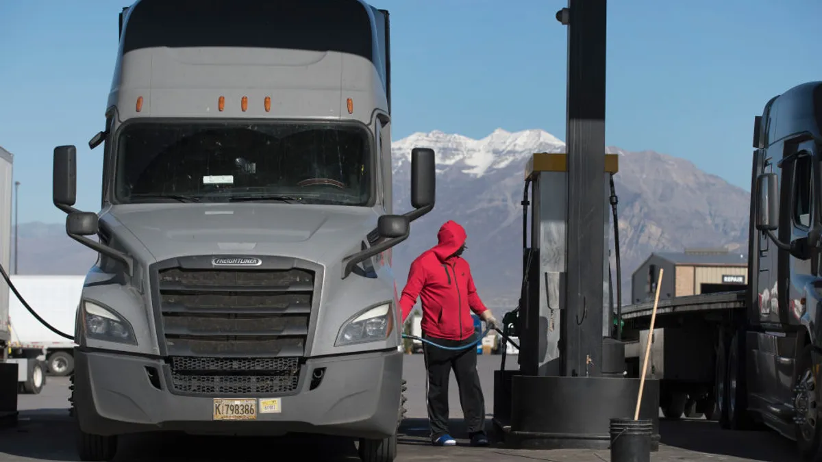 A trucker fuels up his truck at the Love's truck stop in November 2021 in Springville, Utah.