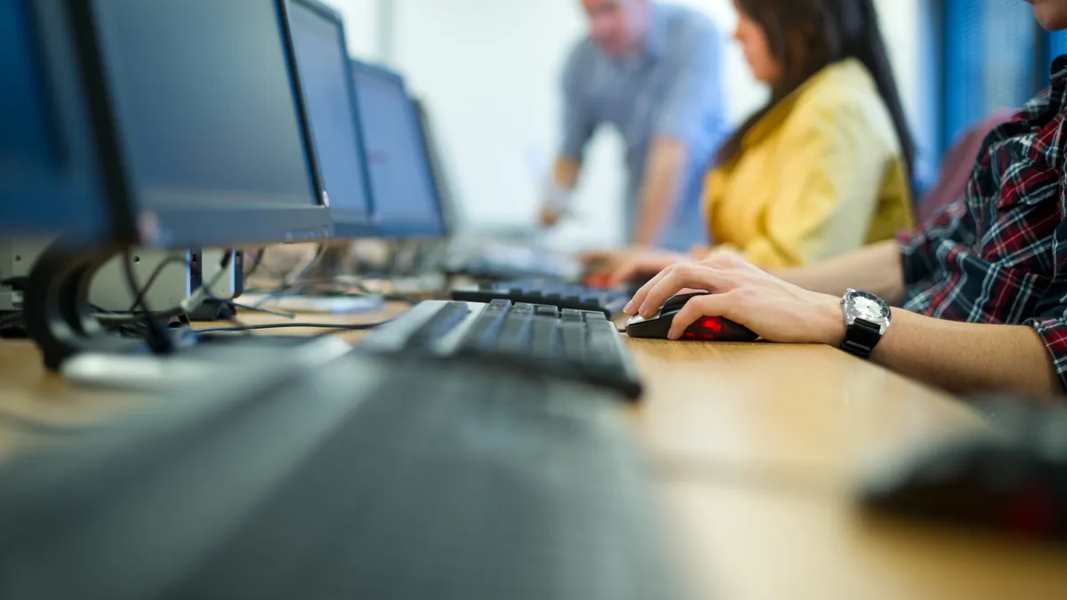 several technology workers seated for a corporate training