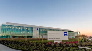 An office building with a horizontal design and landscaping in front.