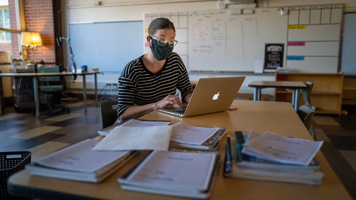 A teacher in the Des Moines, Iowa school system prepares to welcome students back for in-person learning during the pandemic.