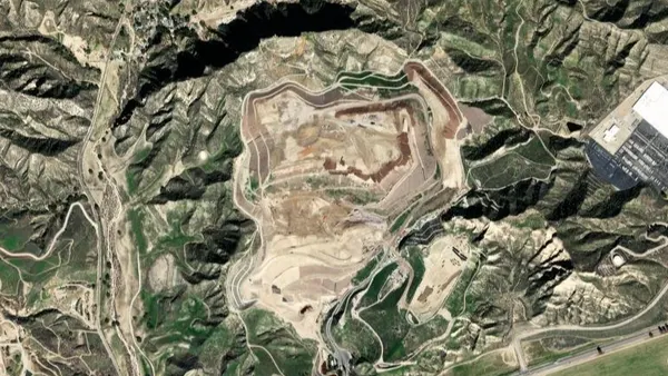 Overhead aerial view of a landfill surrounded by farmland