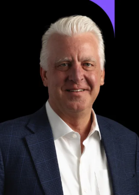 Headshot of a man with grey hair.