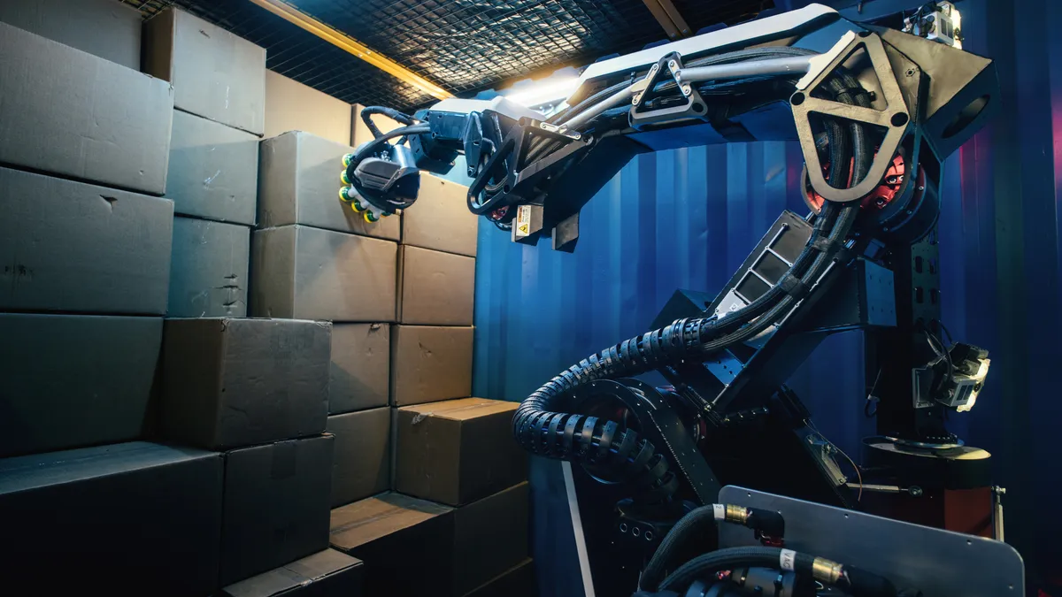 Boston Dynamic's stretch robot unloading a trailer from the robots press release March 2021