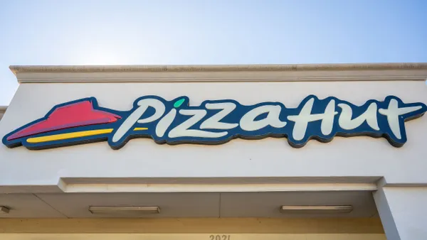 Pizza Hut signage is displayed on a building.