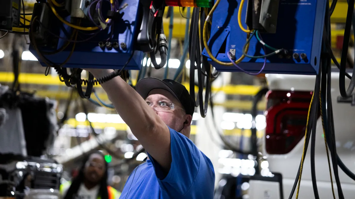 Employees work in a factory.