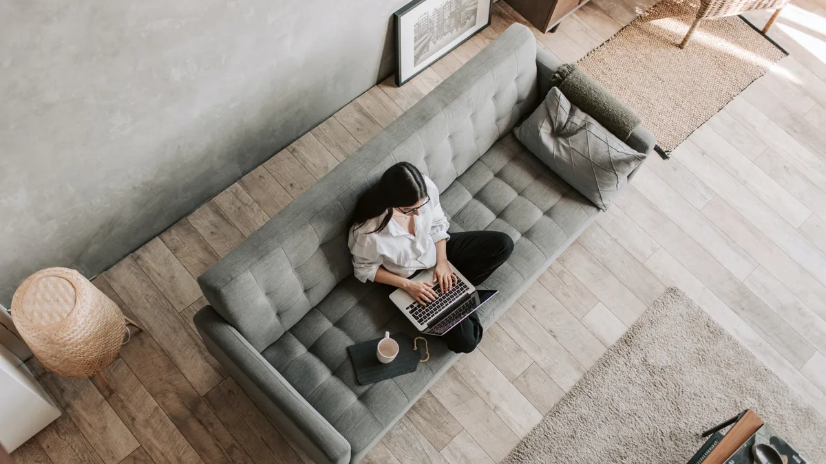 Person using a laptop at home