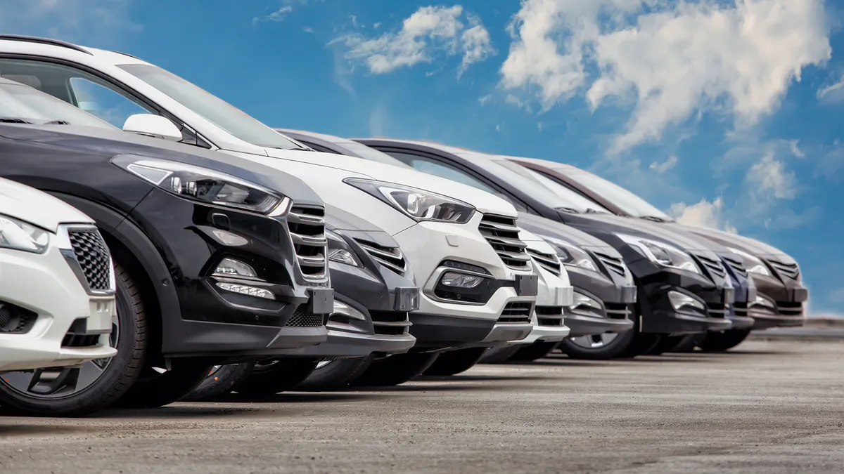 A stock image of cars for sale in a row.