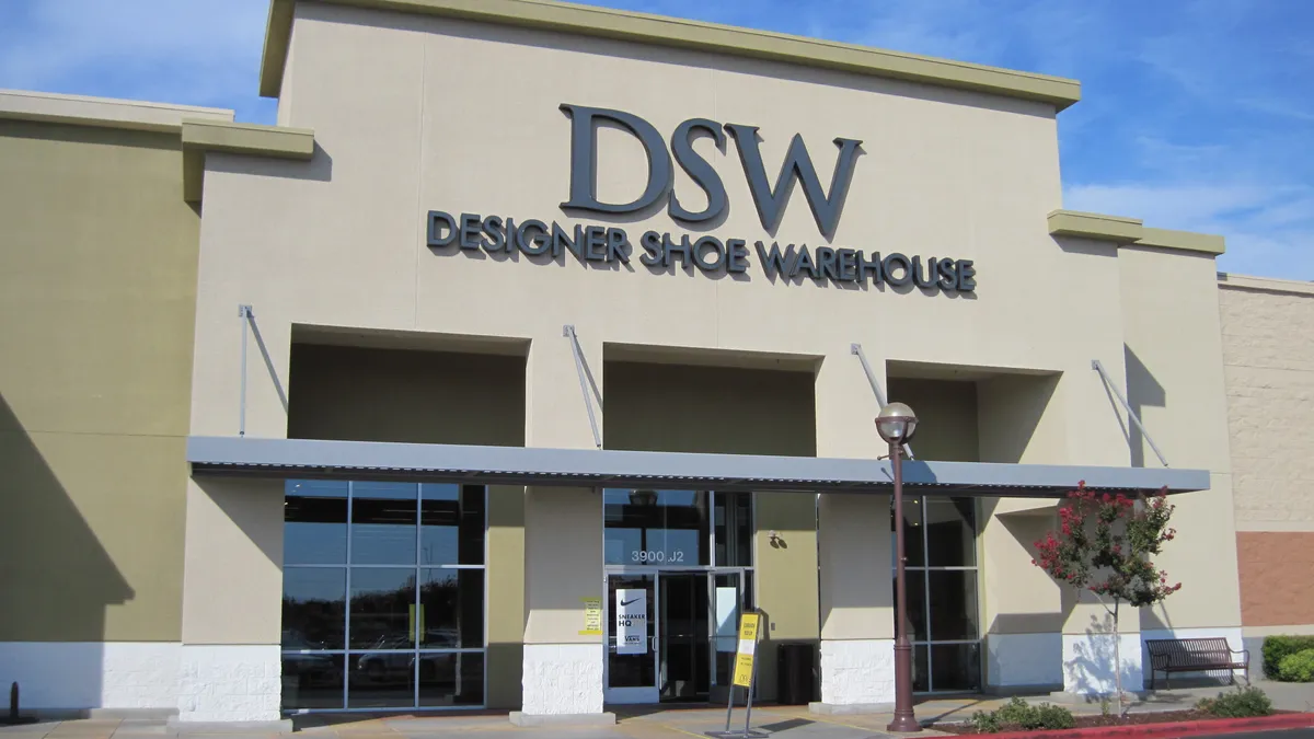 A DSW Shoe Warehouse storefront in California with a blue sky