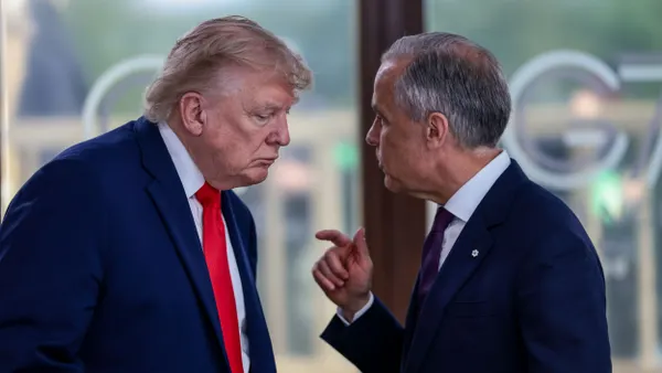 U.S. President Donald Trump speaks with Canadian Prime Minister Mark Carney.