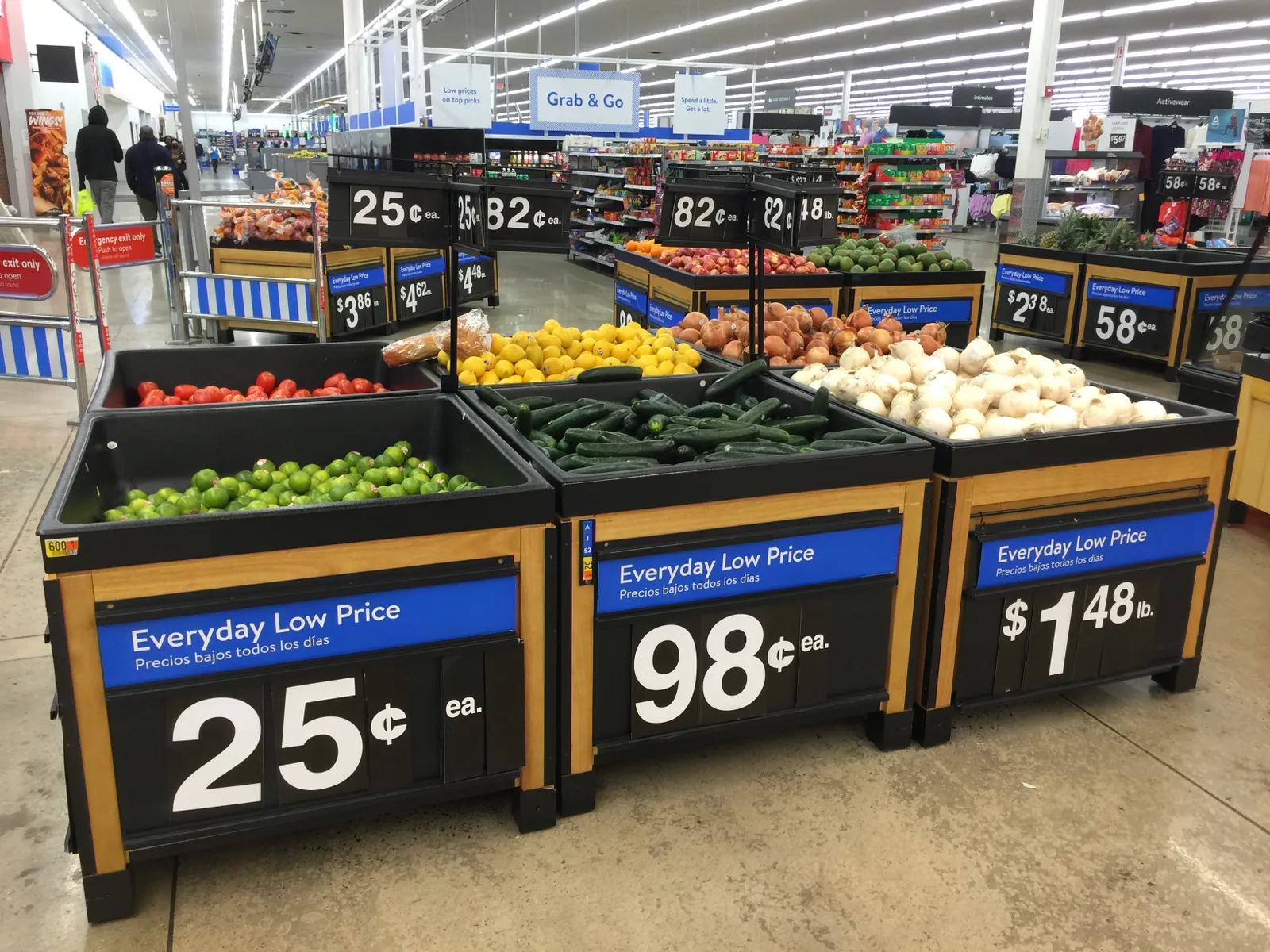 Signage showcasing low prices of produce at a store.