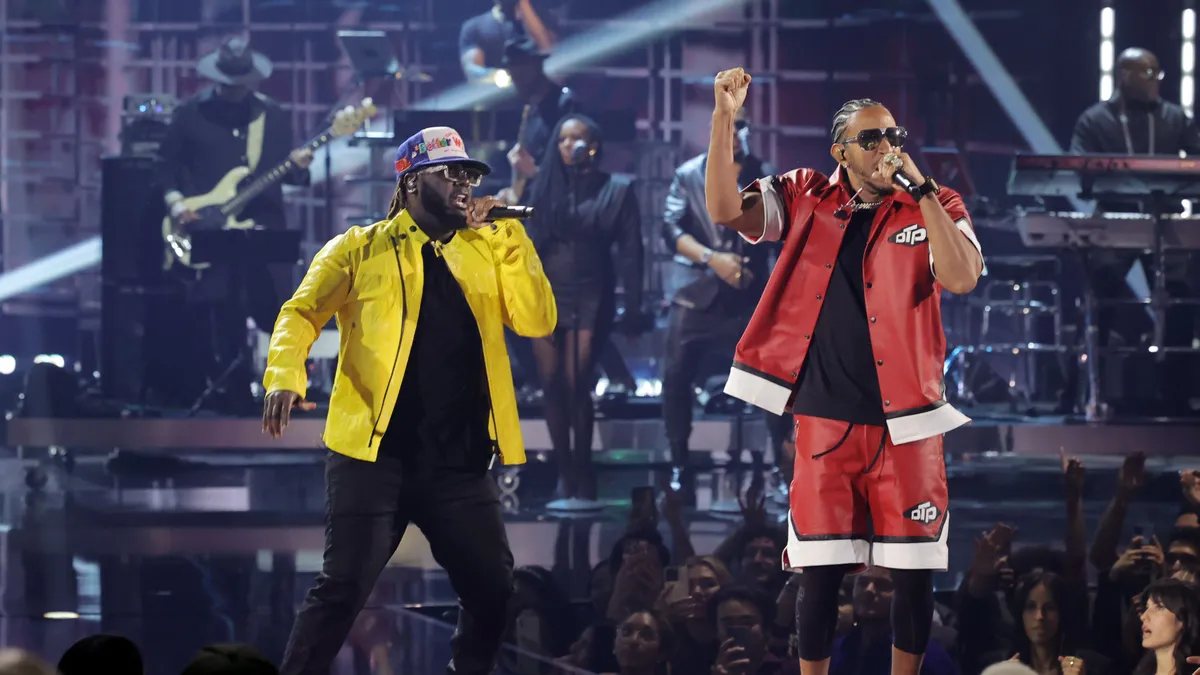 T-Pain and Ludacris perform onstage with mics in their hands at the 2024 iHeartRadio Music Awards.