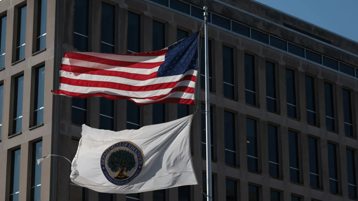 Two flags outside of the U.S. Department of Education's building.