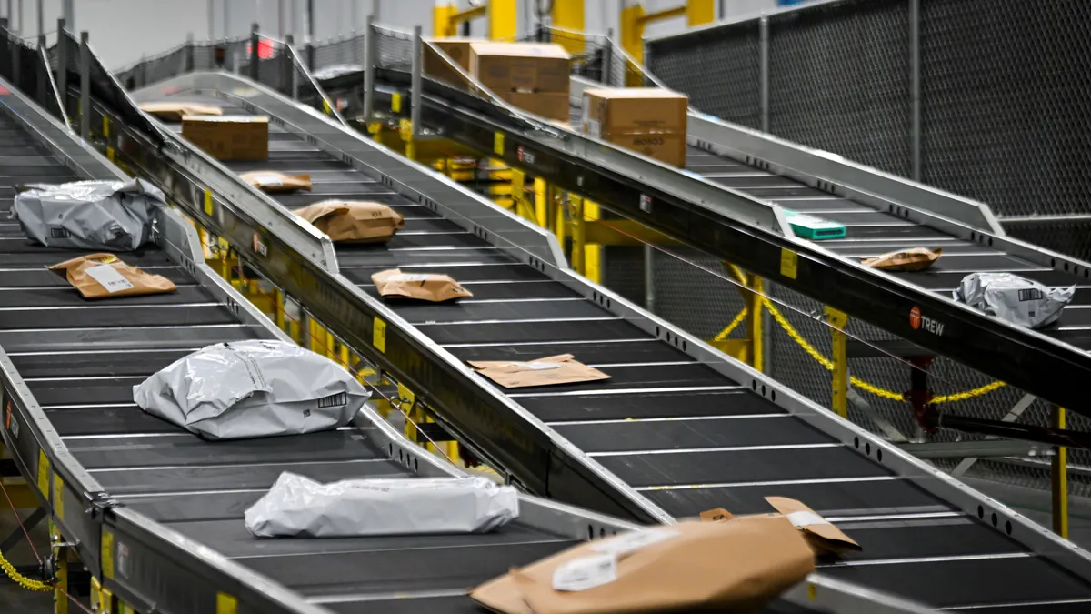 Packages move down a conveyor belt at an Amazon same-day delivery facility in Orlando, Florida, on Dec. 2, 2024.