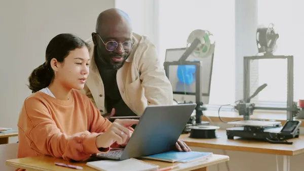 People collaborating on laptop