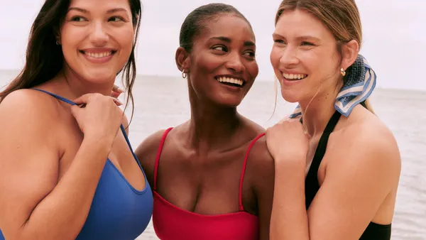 Three people wearing items from Spanx's swimwear collection