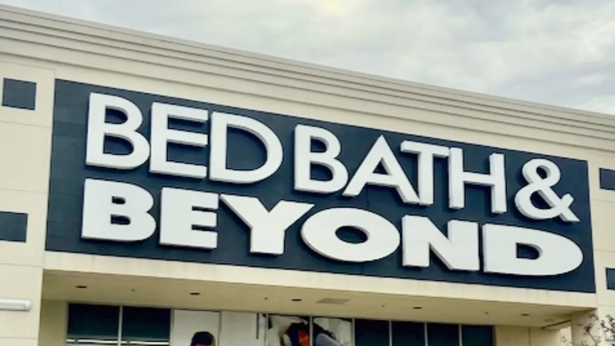 A slightly tilted image of a storefront, closeup, with the words "Bed Bath & Beyond."