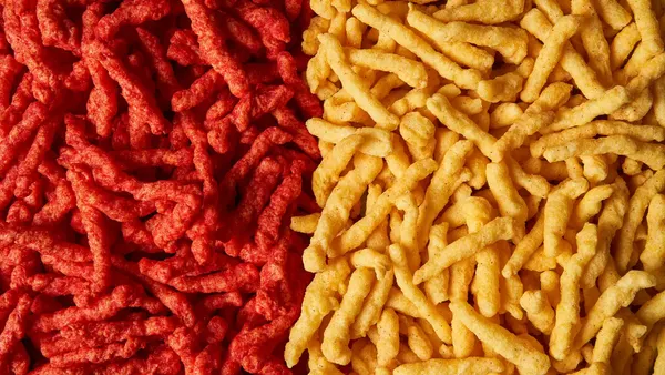 Cheetos Flamin’ Hot without artificial dyes next to their traditional counterparts
