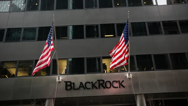 Flags fly above the entrance of the BlackRock offices.