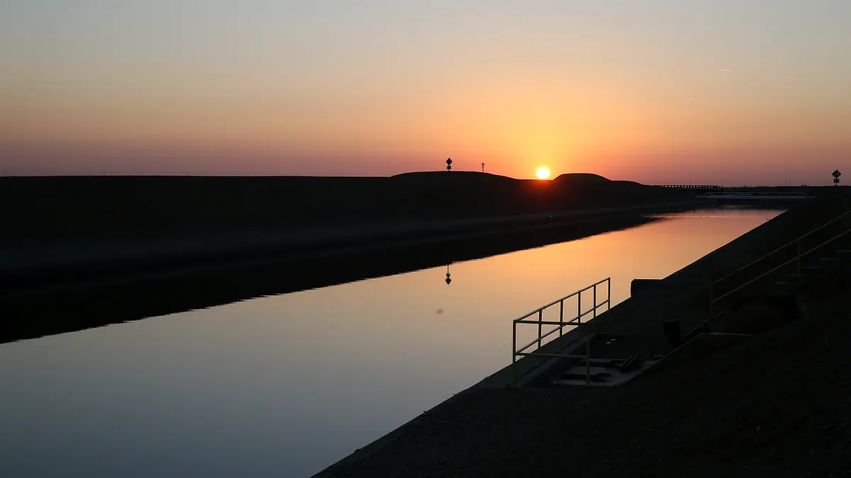 The sun rises over the Delta-Mendota Canal