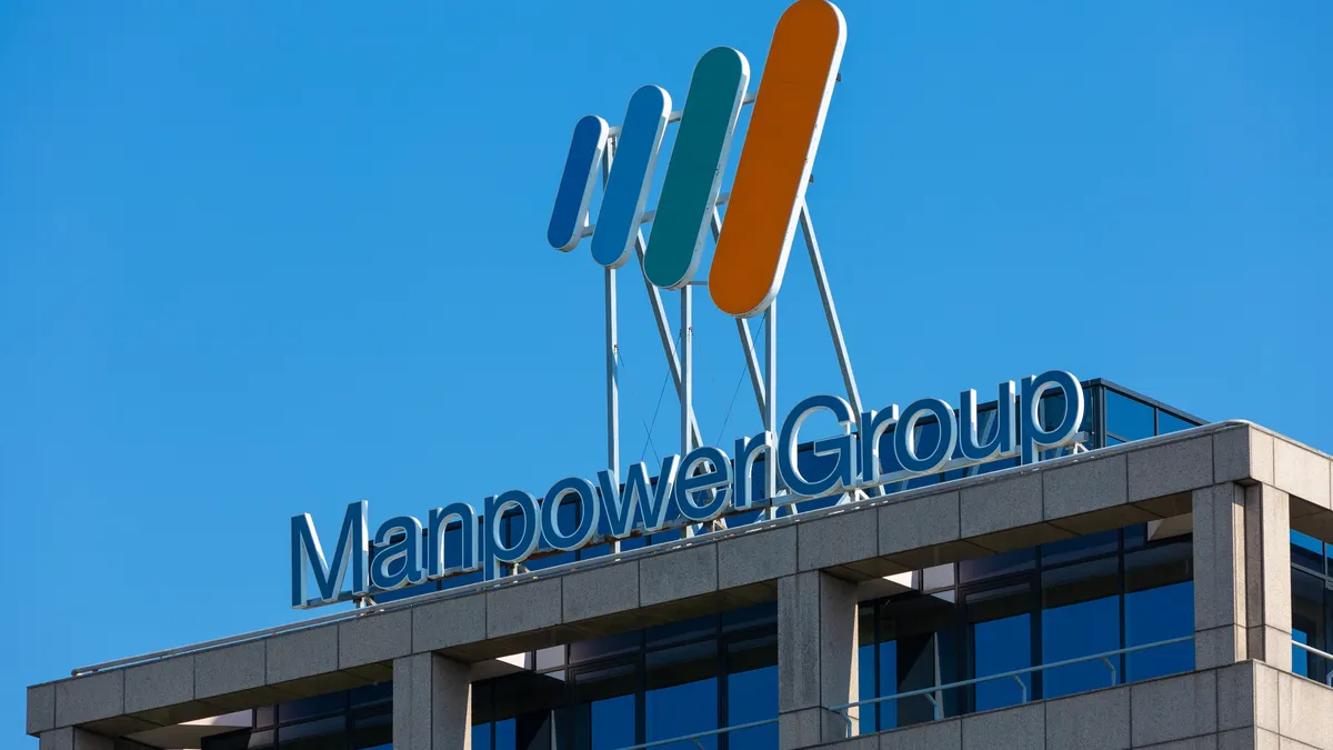 Manpowergroup office roof sign logo. Dutch headquarters of multinational staffing firm Manpower Group in Diemen.
