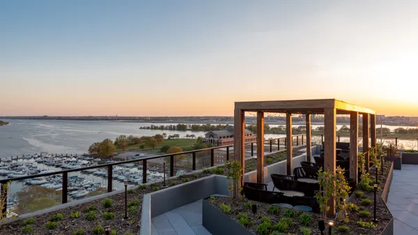 A rooftop garden overlooking a marina.