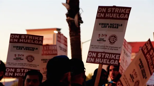 Picket signs read "ON STRIKE."