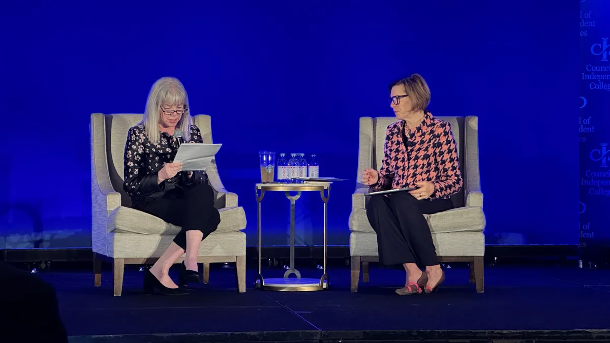 Marjorie Hass and Barbara Mistick speak on stage during the Council of Independent Colleges' Presidents Institute.