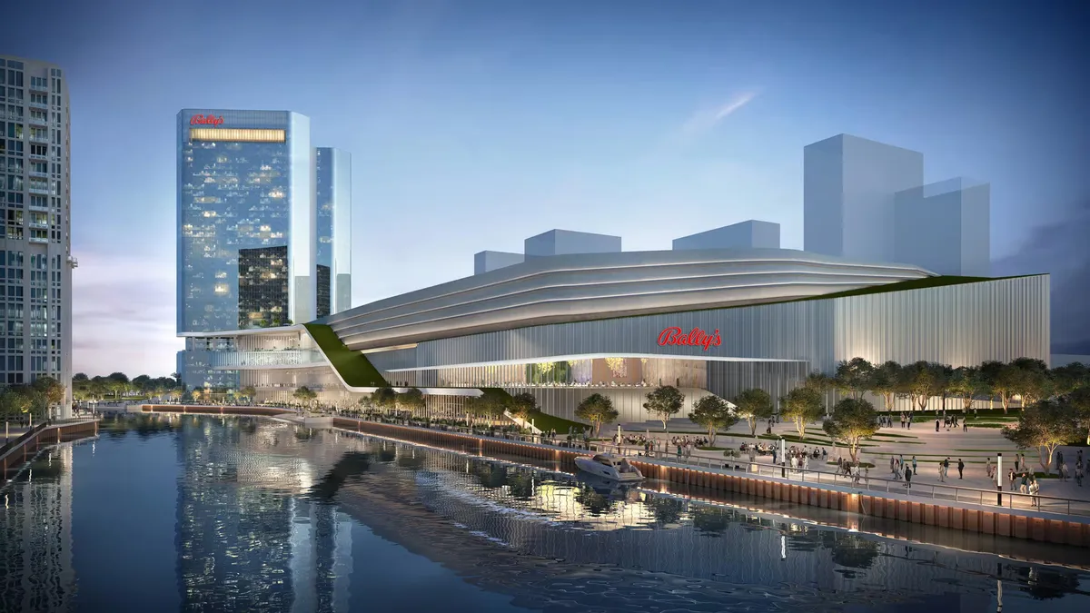 A rendering of a large building in Chicago with the word "Bally's" emblazoned on the side in red, over a river.