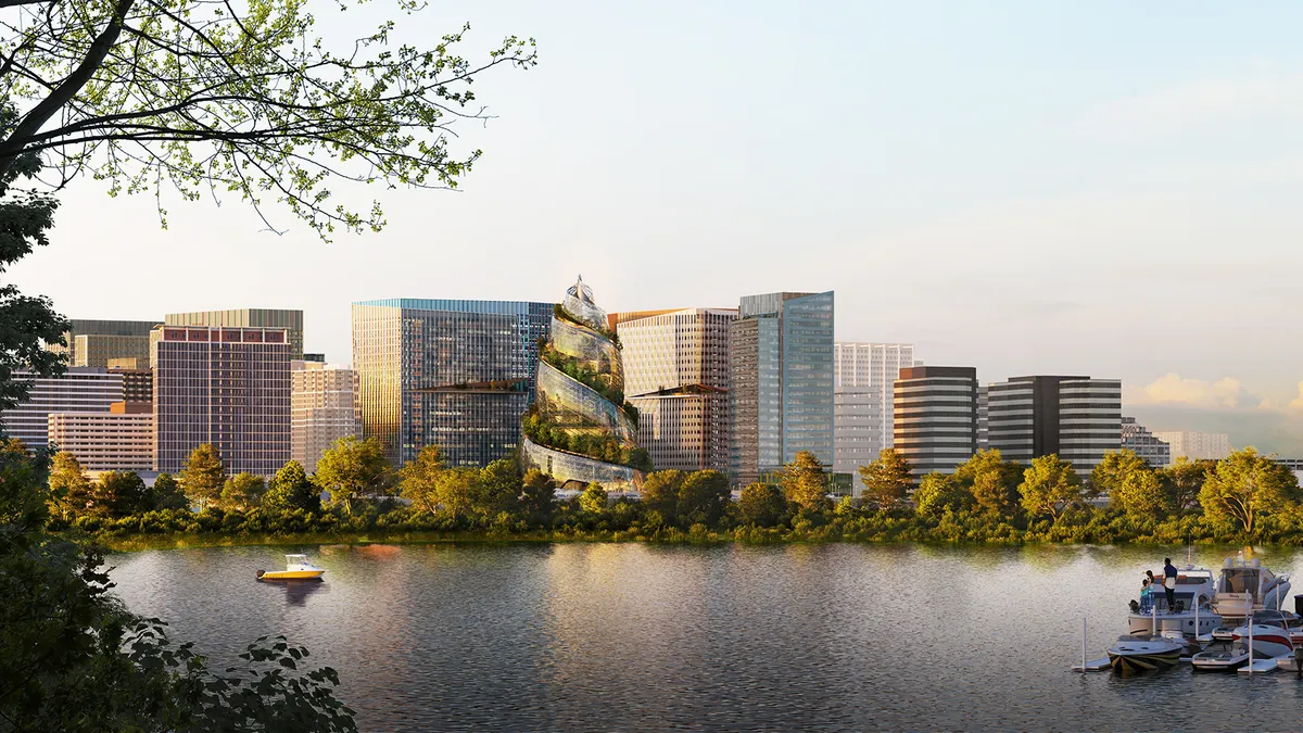 View from across a river showing tall square silver buildings, with a conical swirling building in the middle.