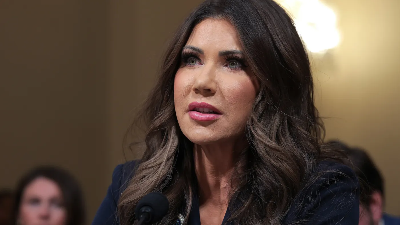 Close-up of a person with long brown hair.