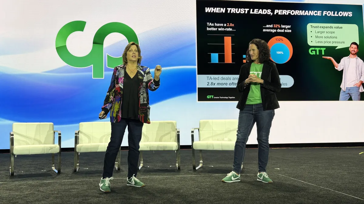 Two women present on a keynote stage