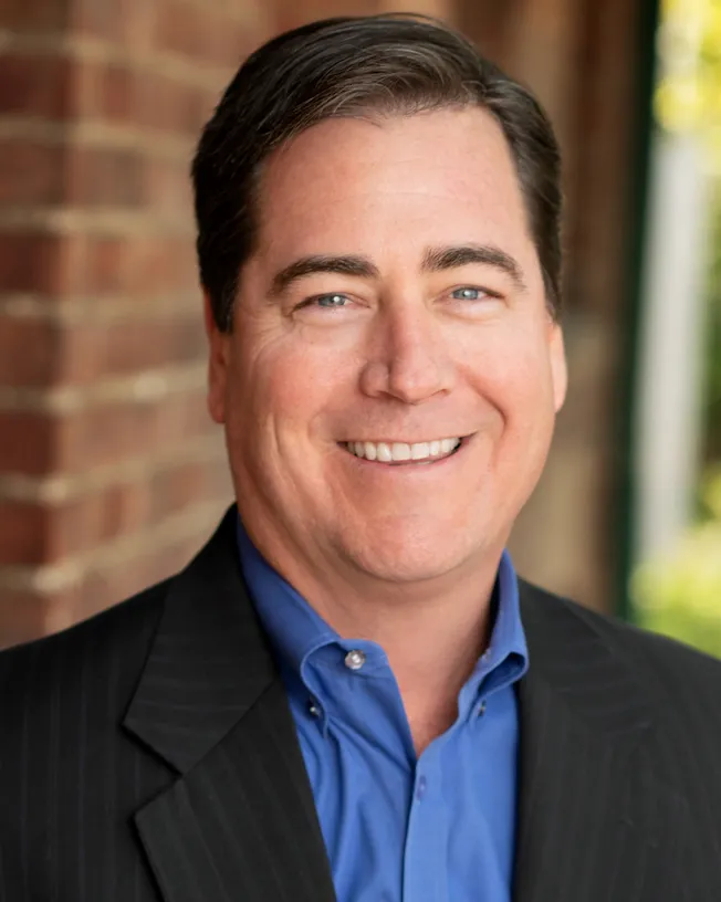 A headshot shows Turner Construction executive Dan Wheeler.